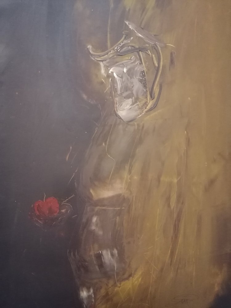 Zamyšlená postava s červeným jablkem od Stefano Mazzolini