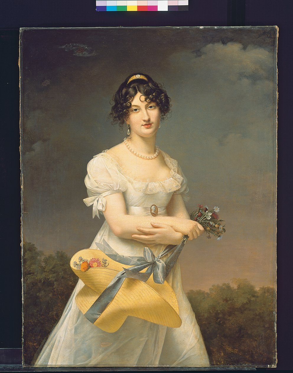 Portrét Amélie-Justine Laidin de la Bouterie, rozené Pontois, držící klobouk plný květin od Adele Romany