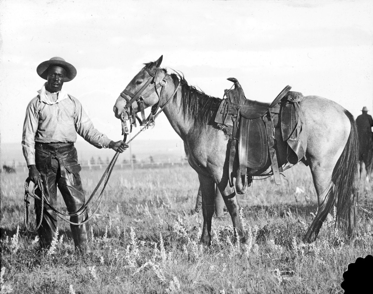 Černý kovboj a kůň, kolem 1890-1920 od American Photographer