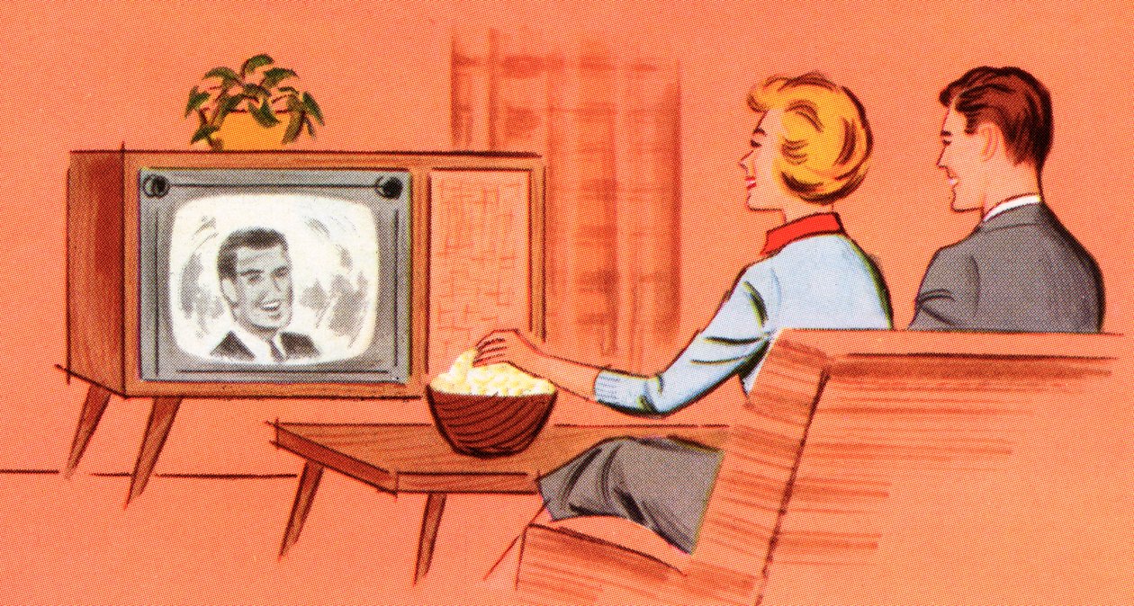 Pár sledující retro televizi v pracovně od American School