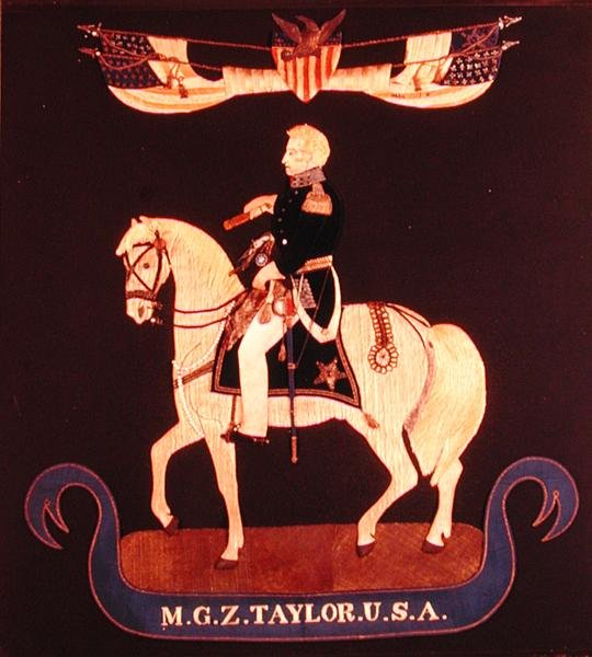 Vyšívaný obrázek zobrazující generálmajora Zacharyho Taylora na koni, kolem 1846-55 (plsť, hedvábí, len, bavlna, kov, kůže, sklo, barva) od American School