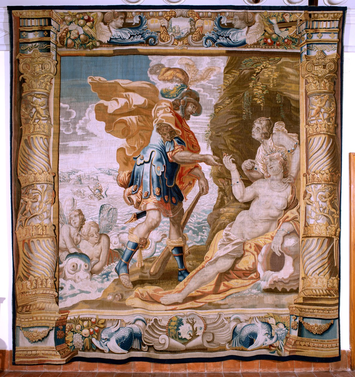 Vlámský gobelín. Seriál Příběh Thésea. Theseus dostává Mínův prsten od Amfitríta (Teseo recibe de Anfítrite la sortija de Minos). Pátá tapisérie v sérii. Model Anthonis Sallaert. Výroba Jan Raes mladší, Brusel. Cca 1630. Tkanina Hedvábí od Antoine or Anthonis Sallaert