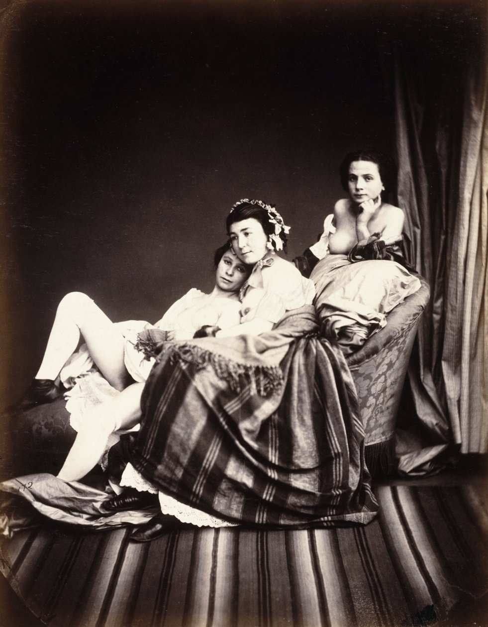 Tři nahé ženy na lehátku, c.1850 od Auguste Belloc