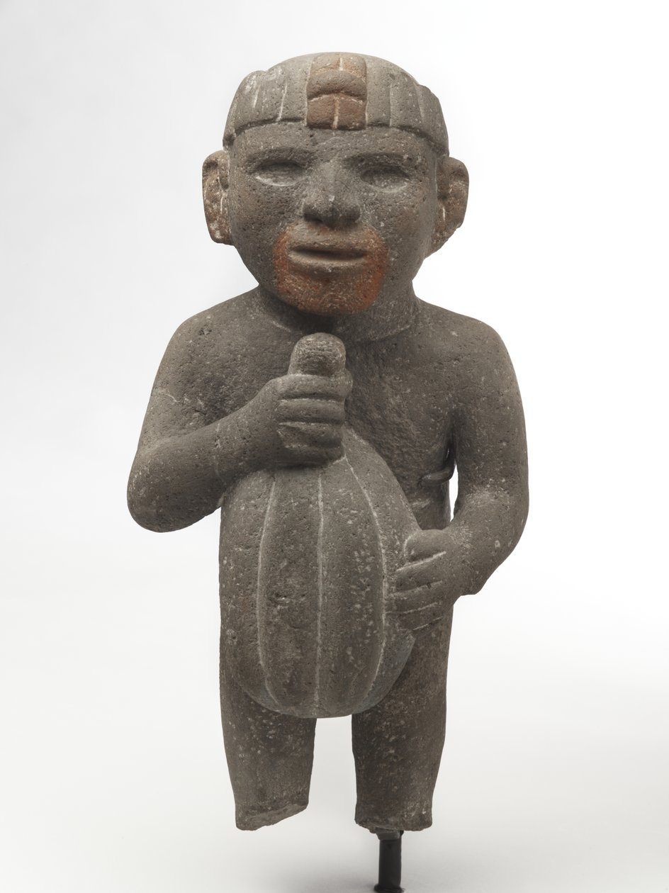 Muž nesoucí kakaový lusk, 1440-1521 (sopečný kámen se stopami červeného pigmentu) od Aztec