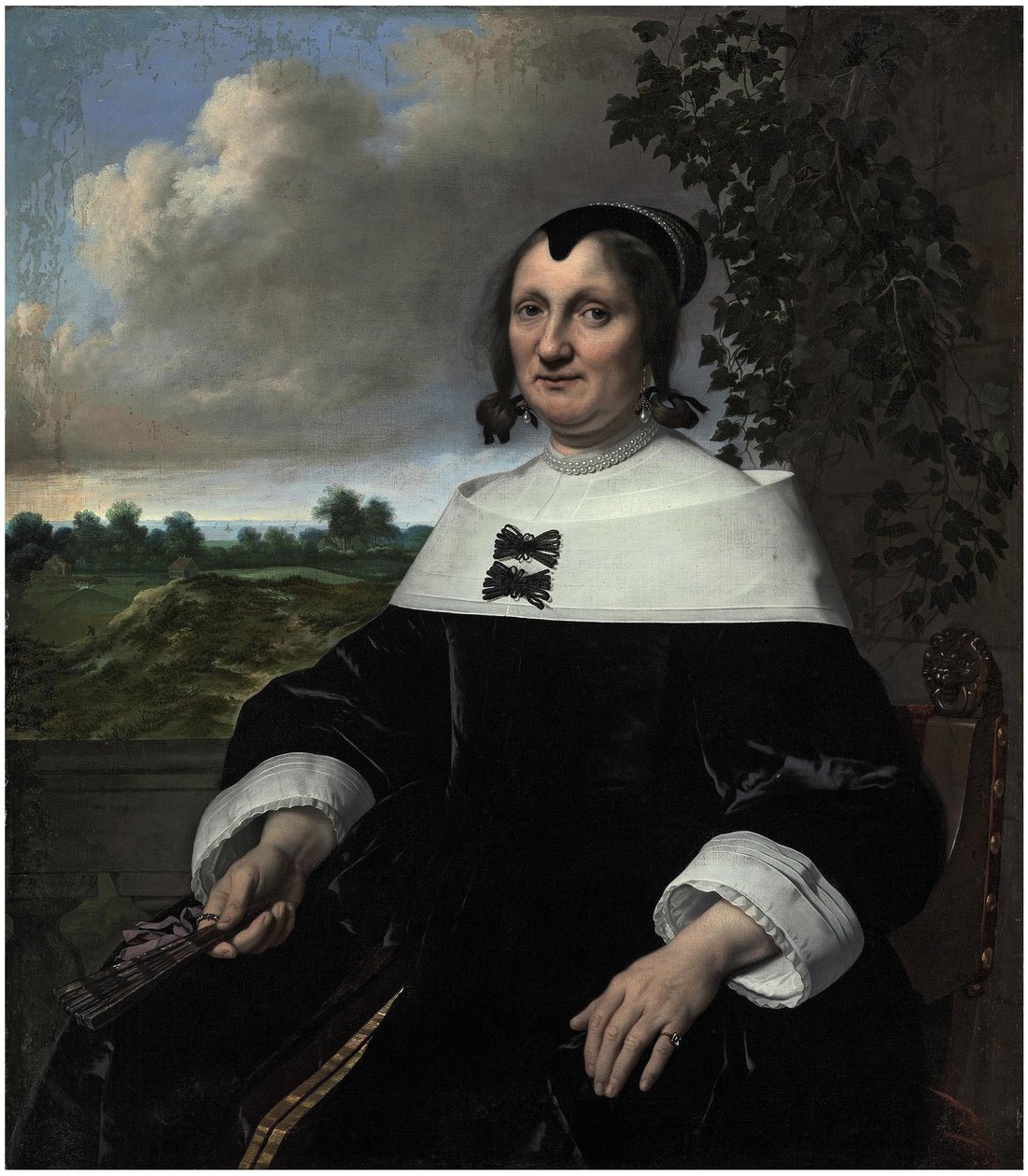 Portrét dámy, pravděpodobně Hester du Pire, sedící před zábradlím, s vějířem v ruce a s výhledem na moře za zábradlím. od Bartholomeus van der Helst