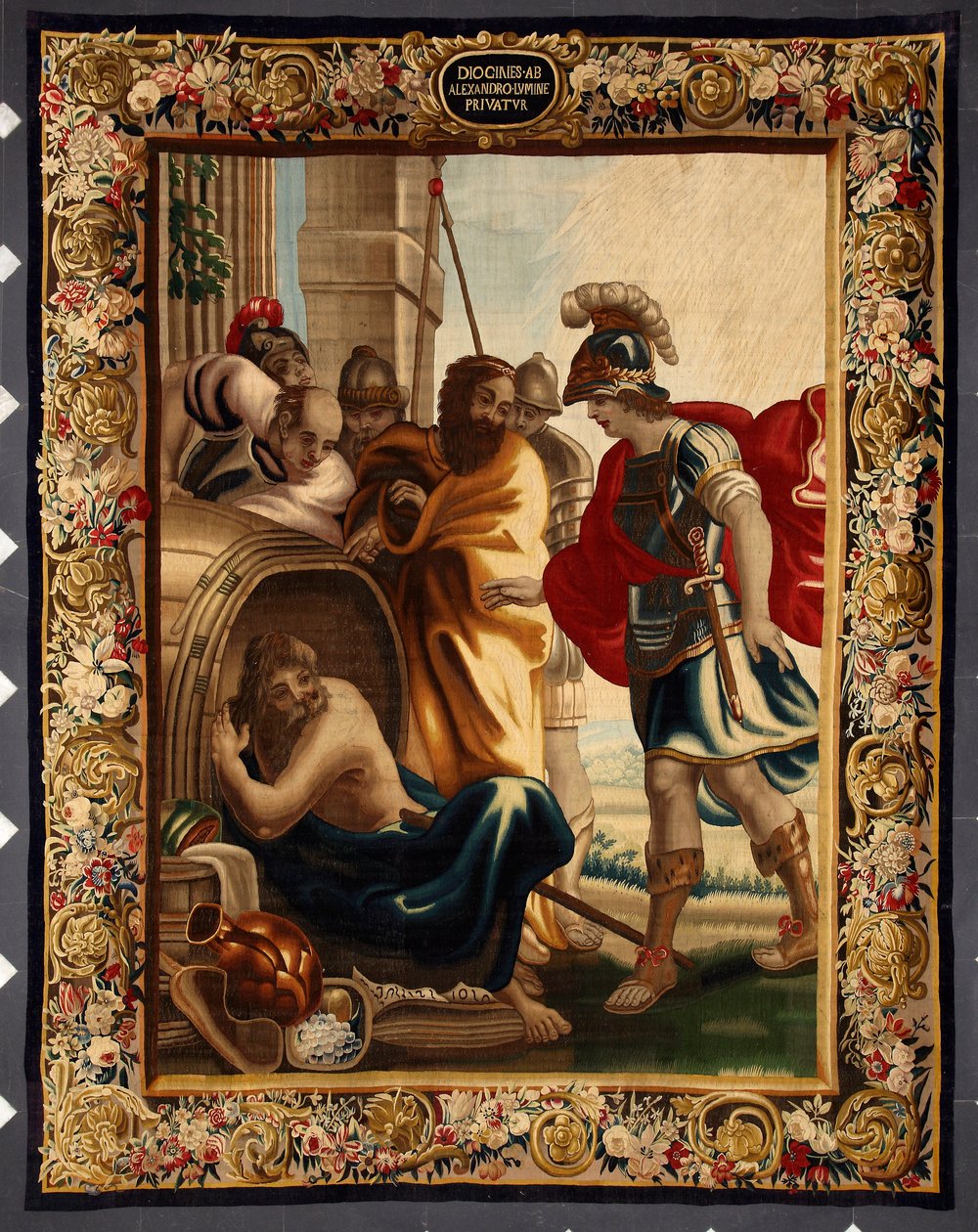 Diogenés a Alexandr: setkání řeckého filozofa Diogenése de Sinope (413-327 př. n. l.) v jeho sudu s králem Alexandrem Velikým (356-323 př. n. l.) v Korintu. Když se ho dobyvatel zeptal, co chce, Diogenés odpověděl: "Sundej mi trochu z mého slunce". Klepnět od Belgian School