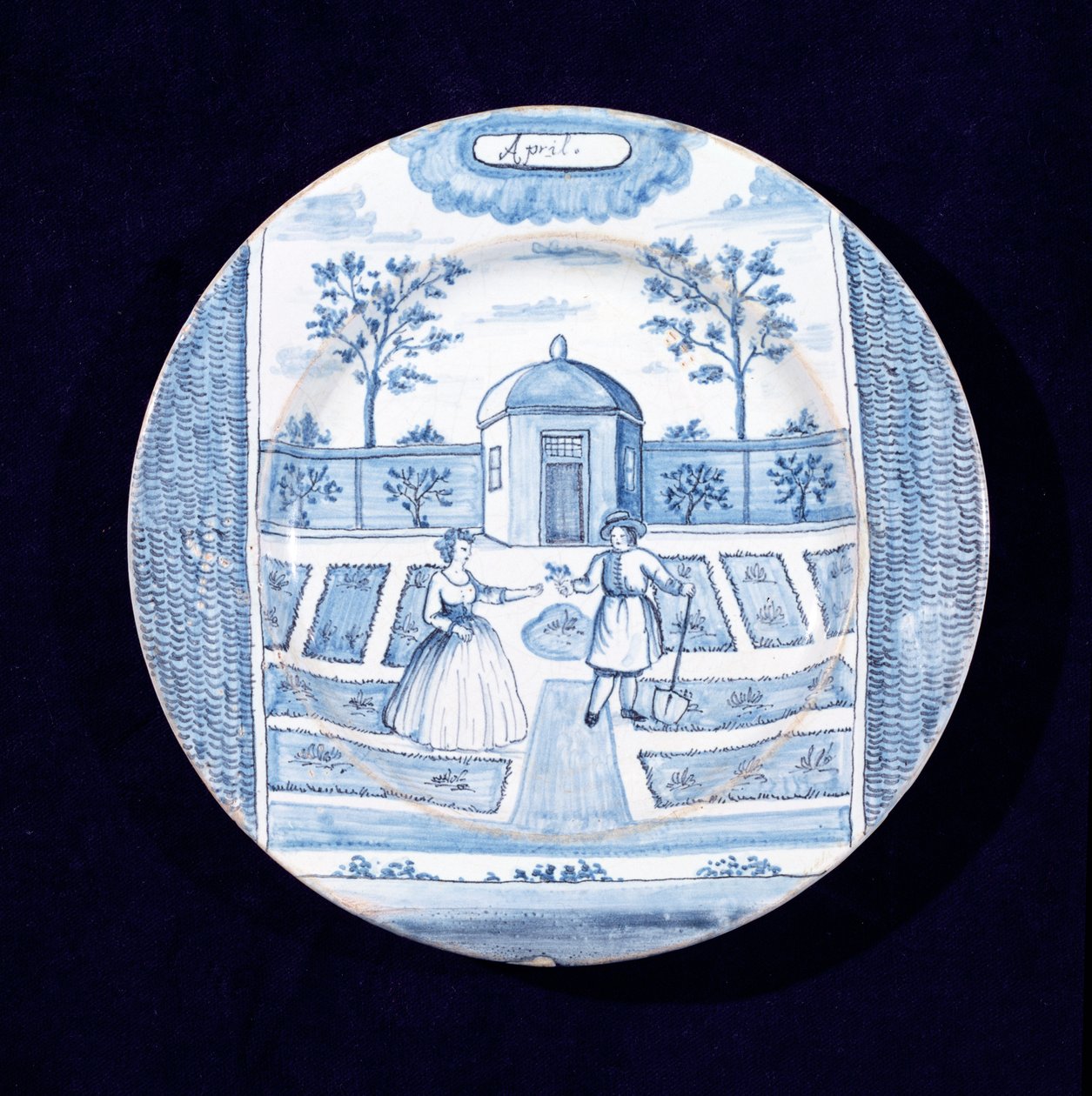 Delftware talíř zobrazující měsíc duben (cínem glazovaná kamenina) od Dutch School
