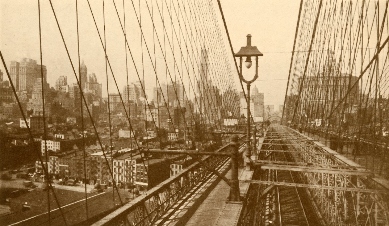 Dolní Manhattan při pohledu přes síť kabelů na visutý most v Brooklynu, c1930. od ENA