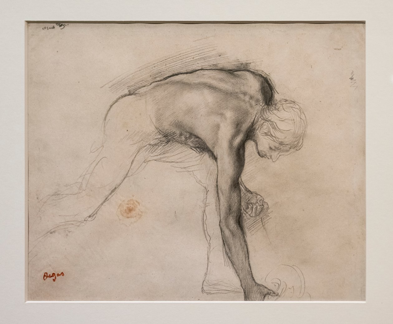 Nahý muž naklánějící se zvedl předmět. Kolem 1859-1861. Grafit na velínovém papíře. od Edgar Degas