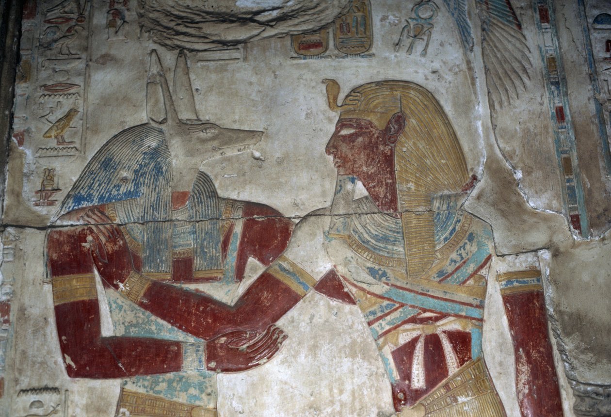 Malovaný reliéf zobrazující faraona a boha Anubise, Osirisova kaple, chrám Setiho I. od Egyptian 19th Dynasty