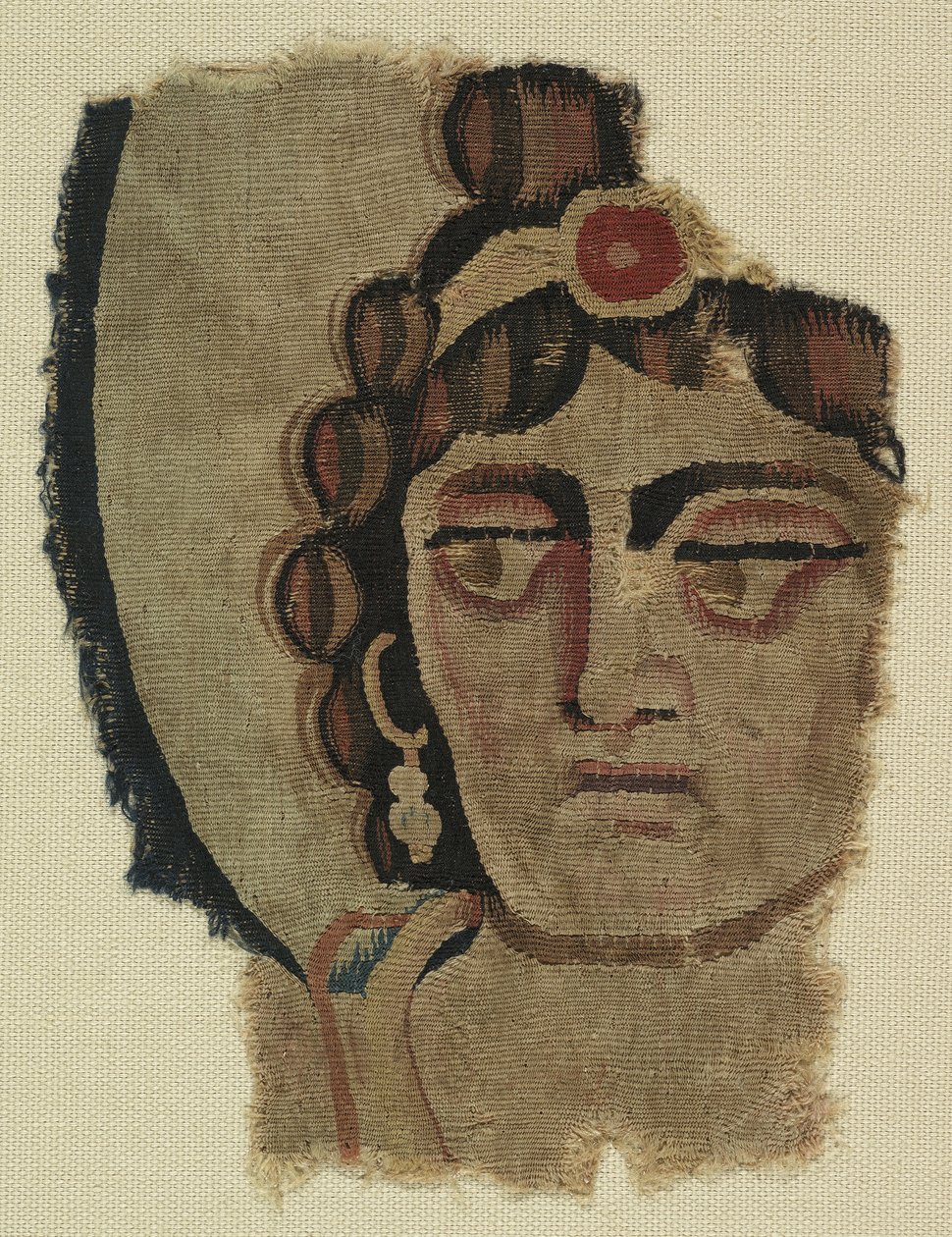 Fragment ženské hlavy, koptština (textil) od Egyptian School