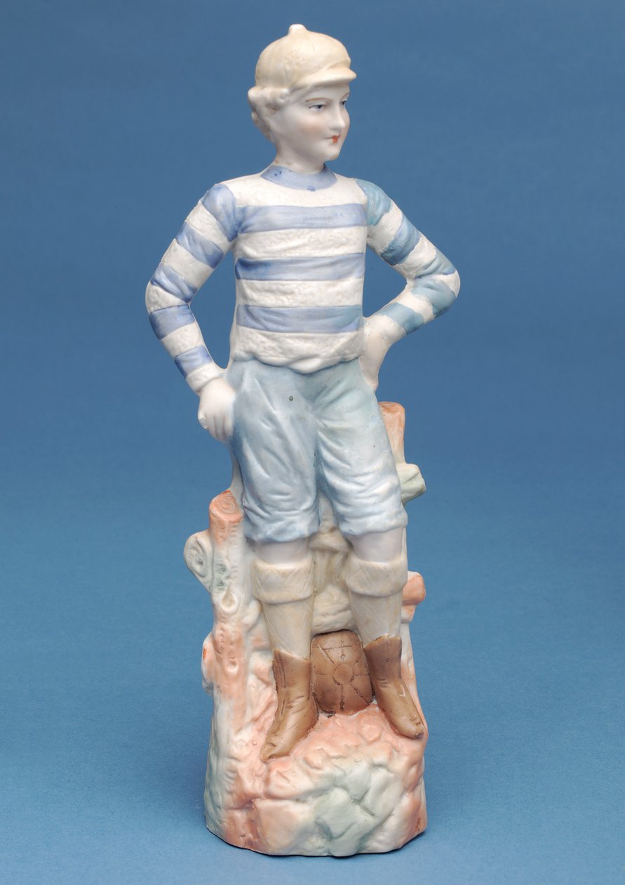 Bisque figurka fotbalového chlapce v modrobílé pruhované soupravě, cca 1890 (keramika) od English School