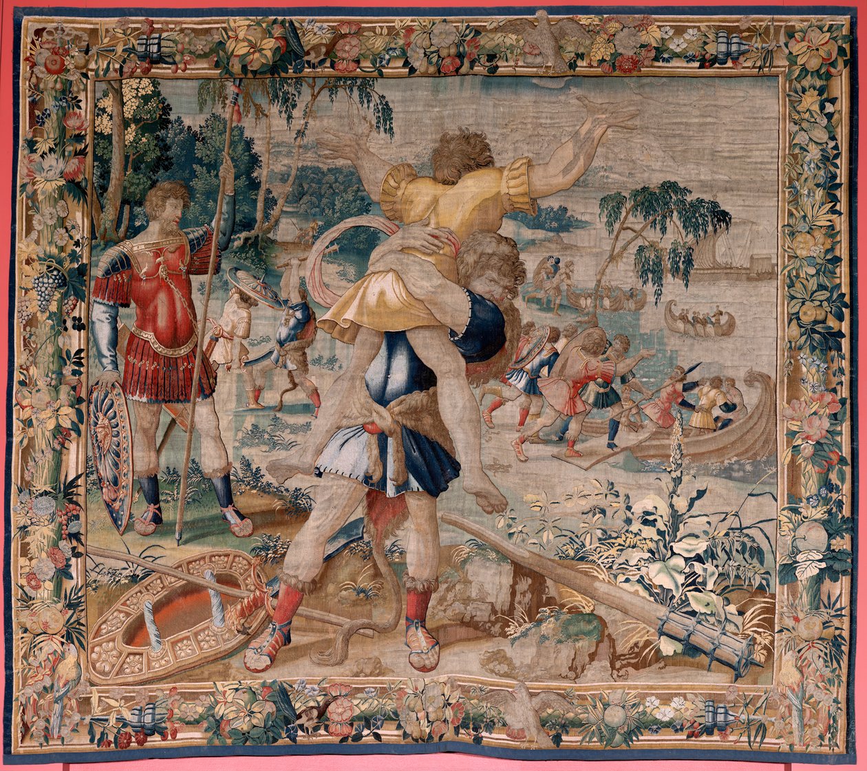 Vlámský gobelín. Seriál The Labors of Hercules. Herkules a Antaeus (Hércules y Anteo). Čtvrtá tapisérie v dochované sérii. ; Model neznámý. Výroba Willem Dermoyen, Brusel. Ca 1528. Látka Hedvábí a vlna. Rozměr 362 x 403 cm. Místo Královský palác od Flemish School