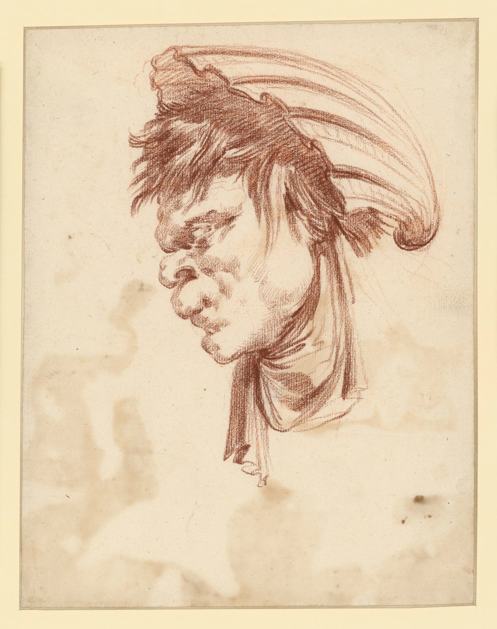 Groteskní hlava v profilu doleva s mušlí jako pokrývkou hlavy od François Boucher