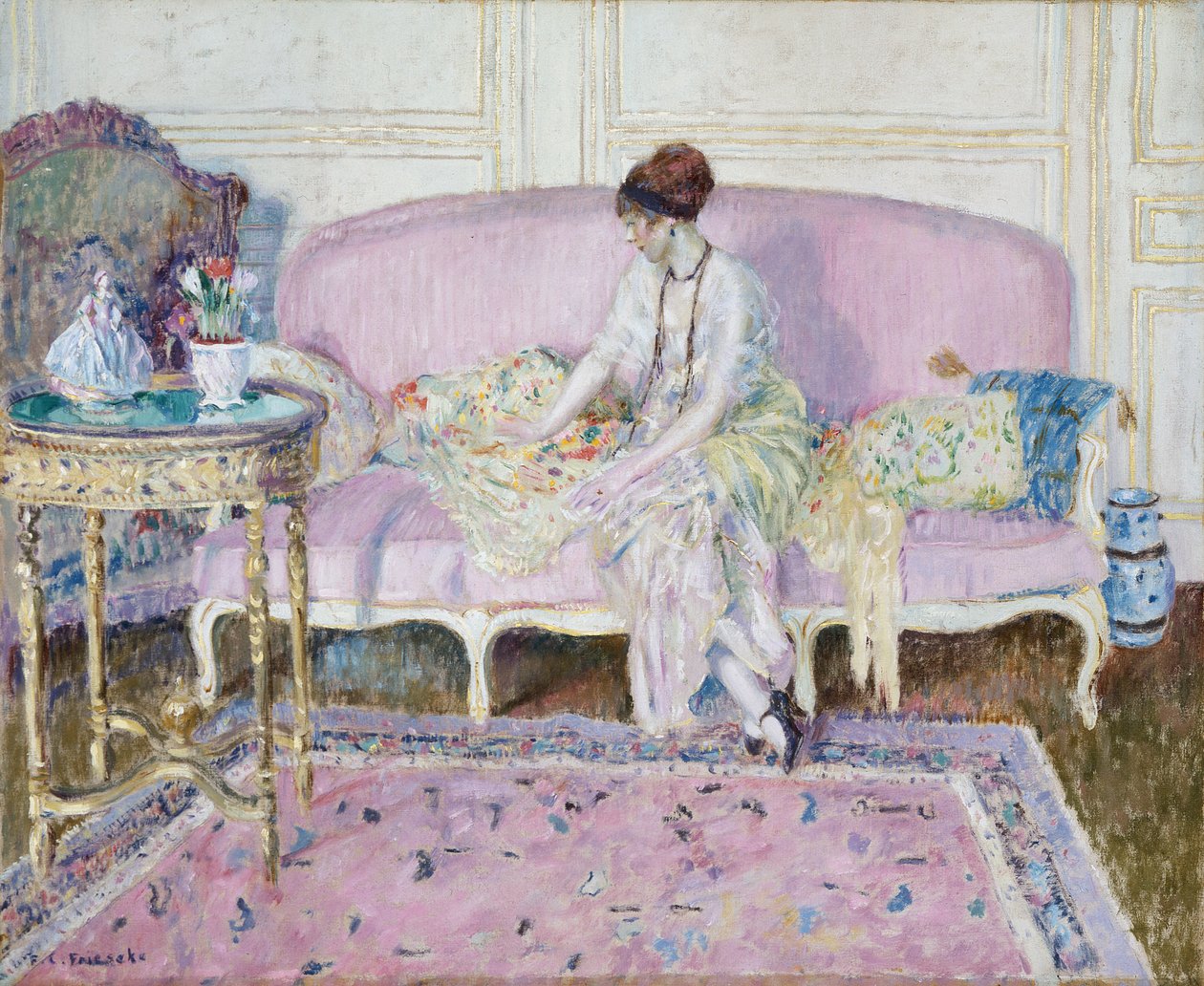 Žena sedící na pohovce v interiéru od Frederick Carl Frieseke