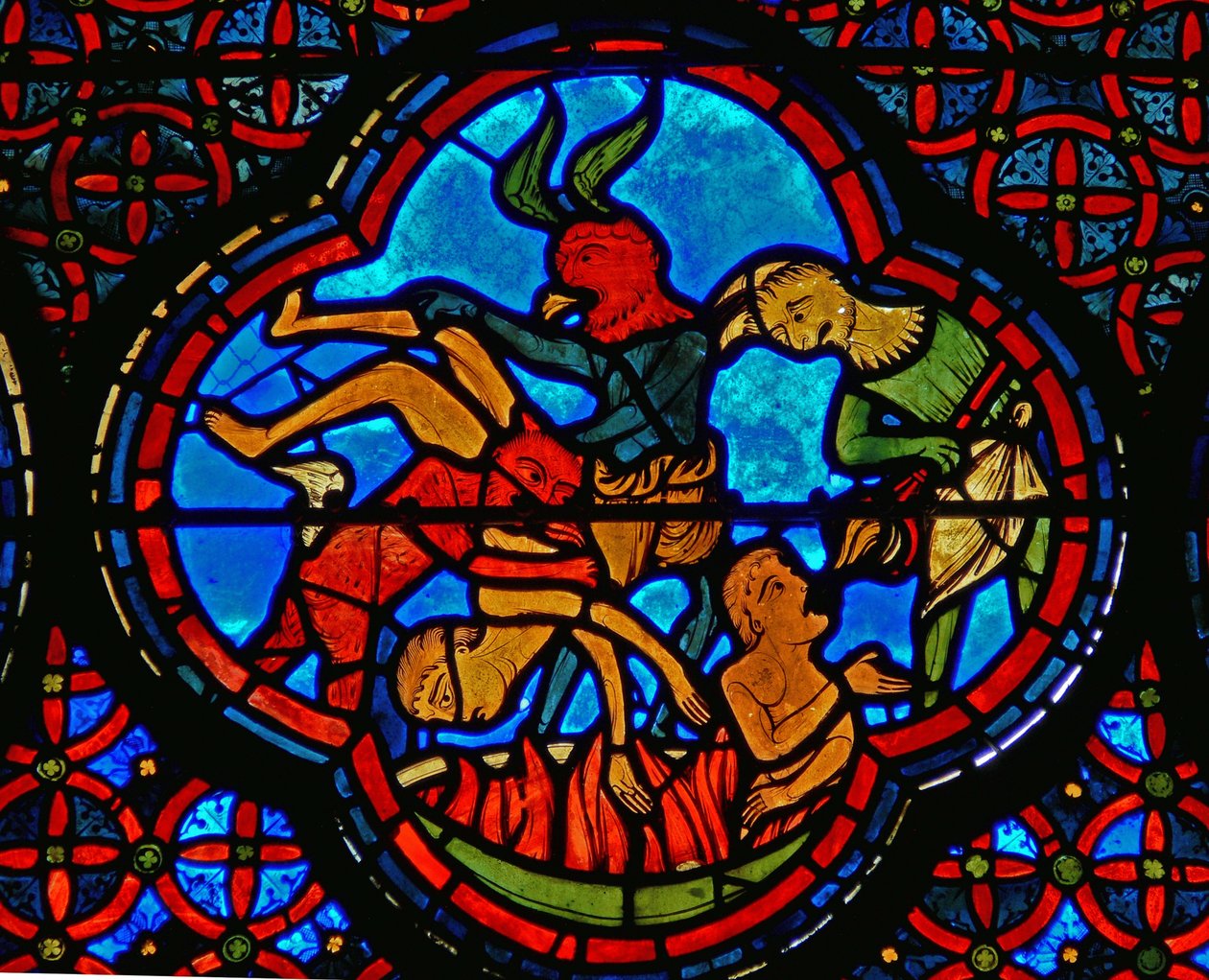 Detail z okna zobrazující podobenství o Lazarovi a Dives: boháč v pekle od French School