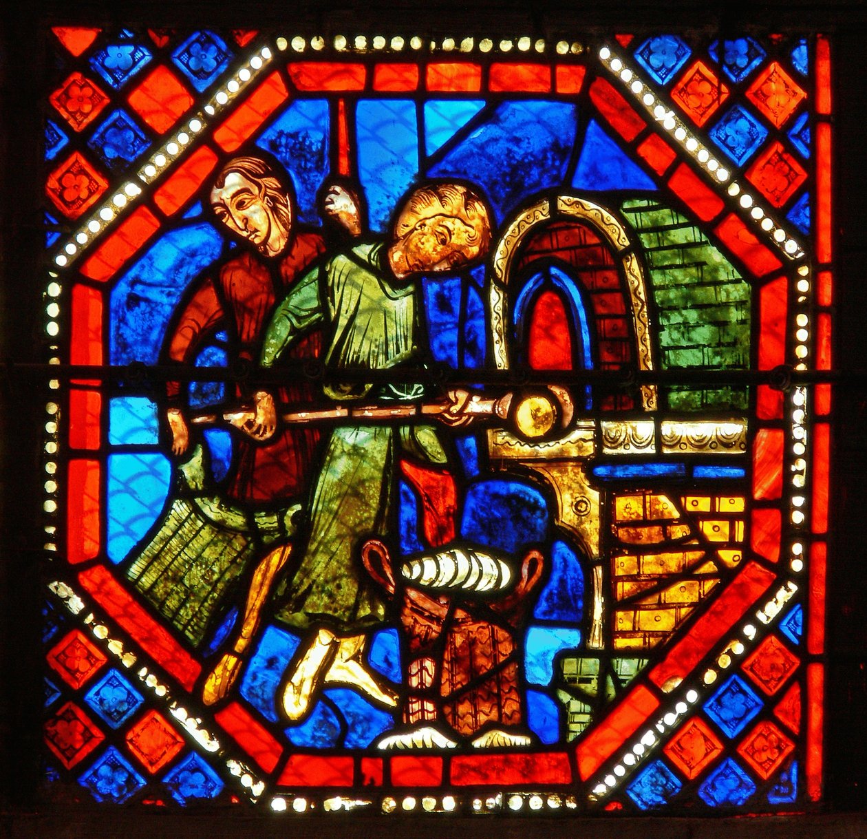 Detail z okna svatého Jana: pekaři v práci od French School