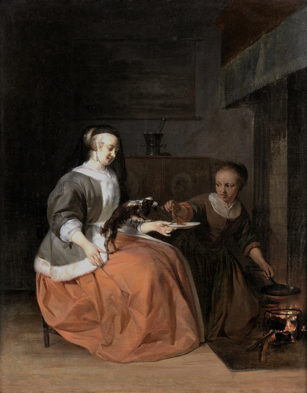 Mladá žena a služebná krmí psa palačinkou od Gabriel Metsu