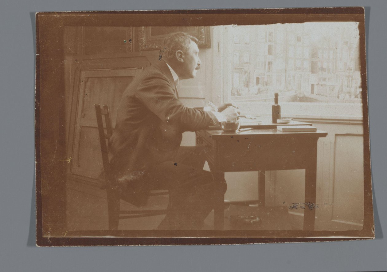 Willem Witsen u psacího stolu ve své lodi od George Hendrik Breitner