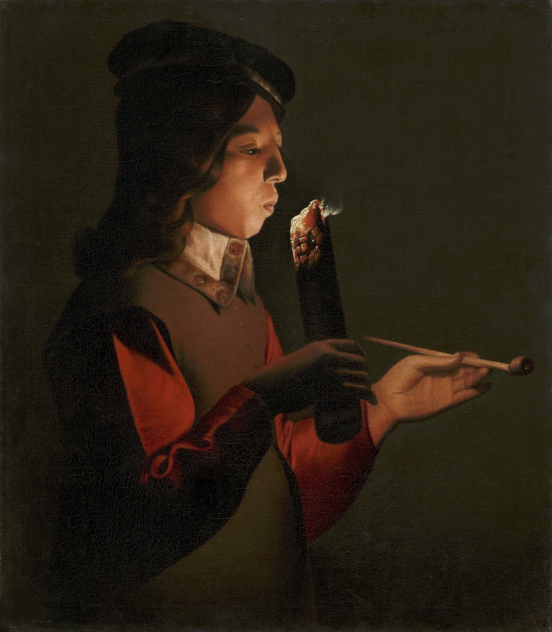 Mladý chlapec s dýmkou, foukající do ohně, od La Tour, Georges, de (1583-1652). olej na plátně od Georges de La Tour