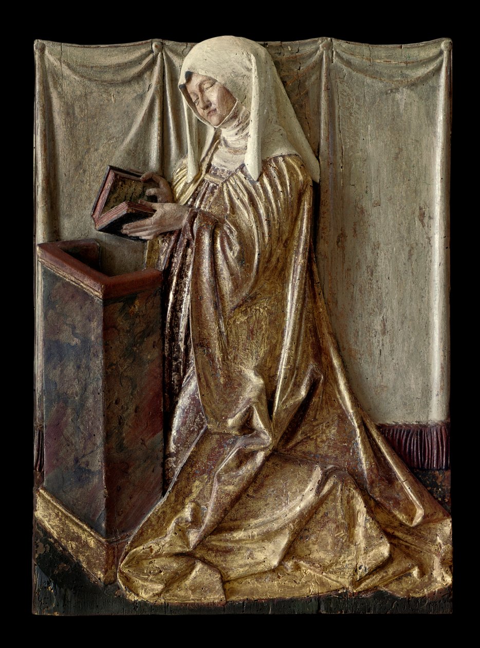Klečící donátor Fragment vyřezávaného oltářního obrazu z polychromovaného dřeva. Ze Švábska. cca 1520 Paříž, muzeum Louvre od German School