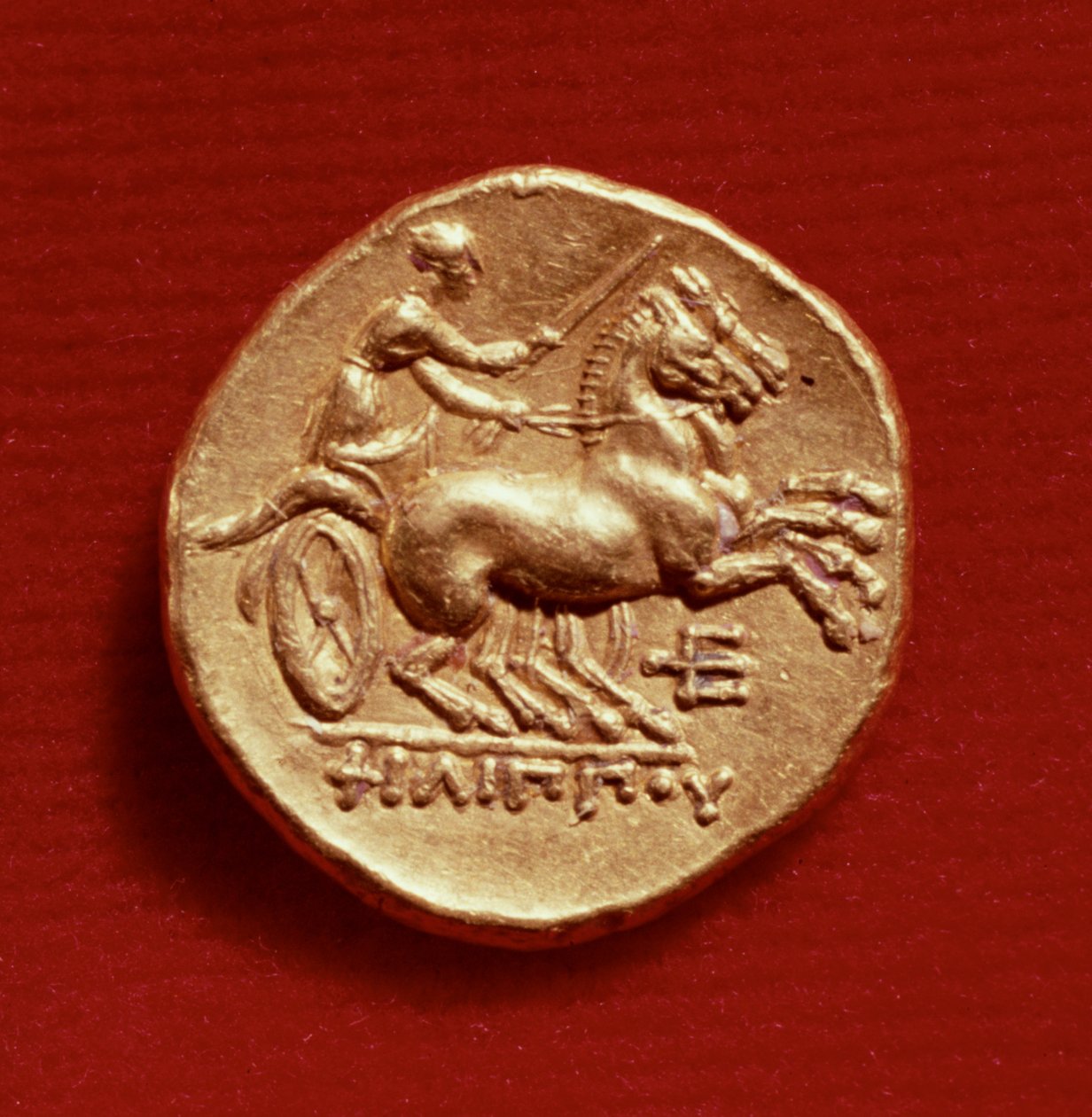 Rub statéru Filipa II. (382–336 př. n. l.) z Makedonie zobrazující vozataje, 356–336 př. n. l. (zlato) od Greek School