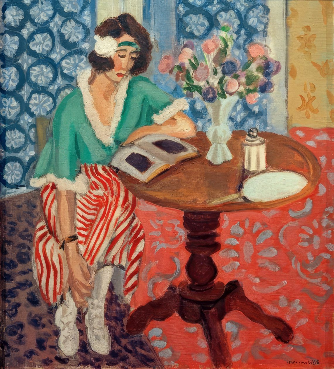 Žena čtoucí u stolu ((v zelených, červených pruhovaných šatech) od Henri Matisse