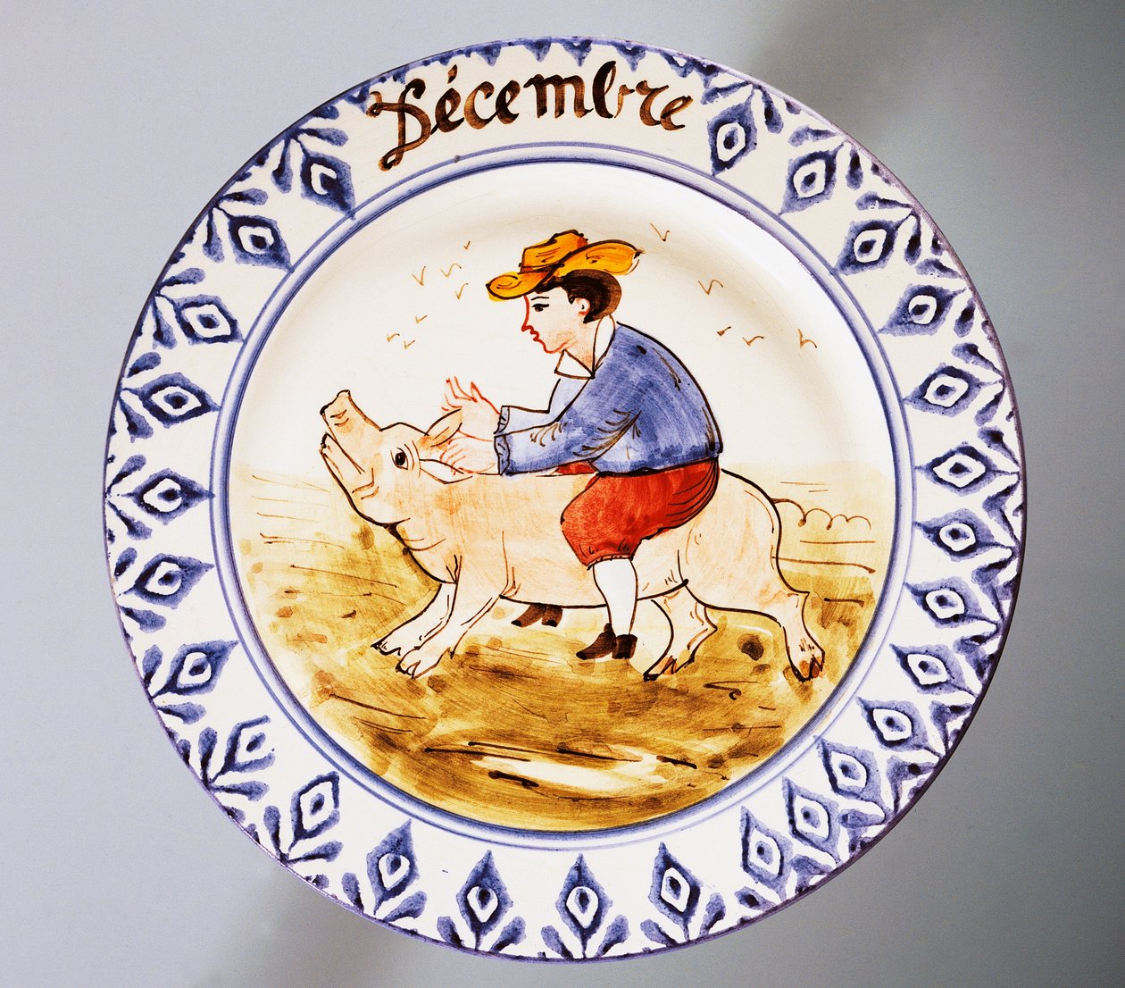 Talíř s vyobrazením měsíců, prosinec, keramika, manufaktura Nove di Bassano, region Veneto, Itálie, 20. století. od Italian School
