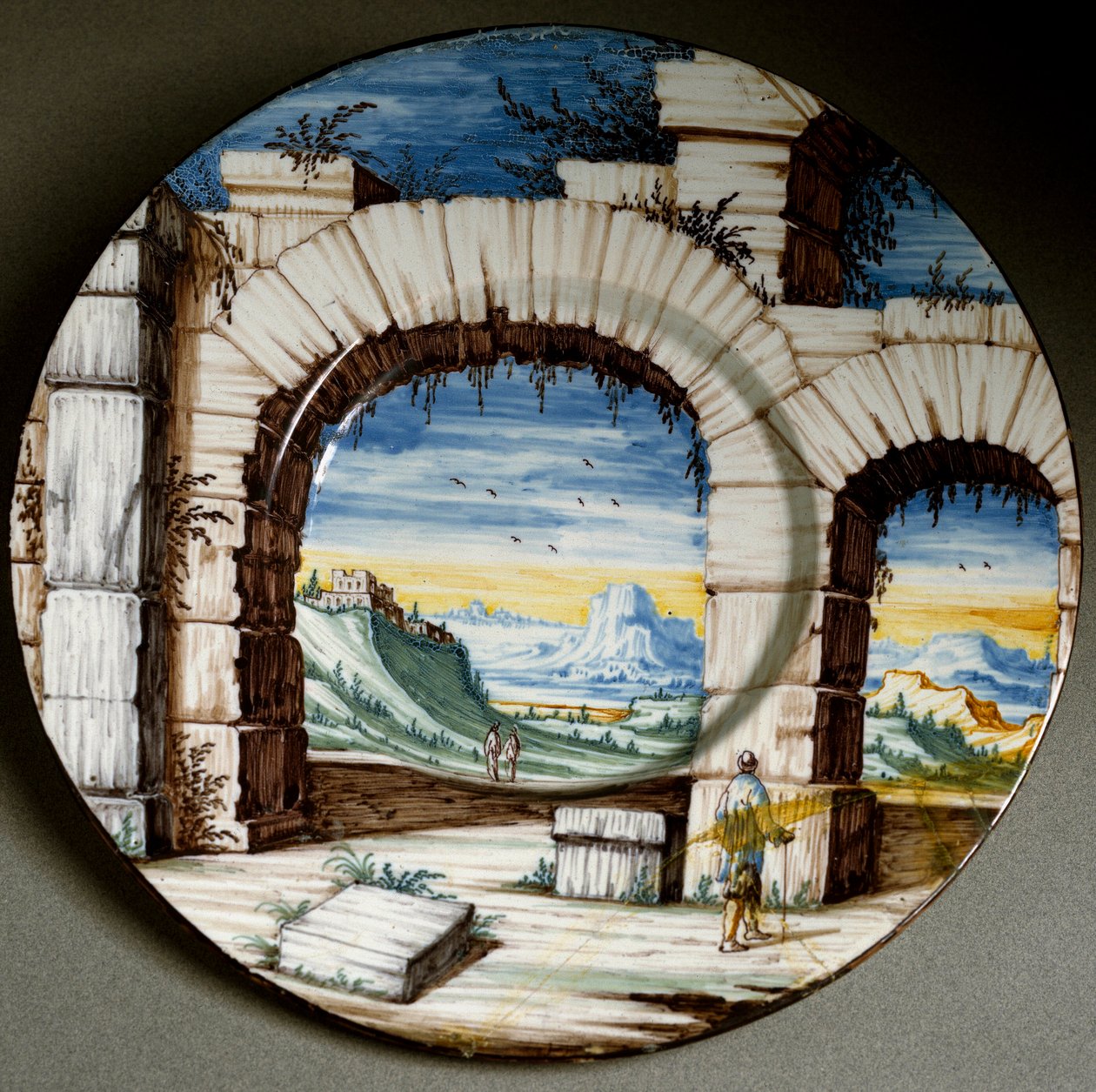 Zřícenina a krajina. Keramický talíř vyrobený v Angarano, Itálie. Kolem roku 1650 Florencie, Národní muzeum Bargello od Italian School