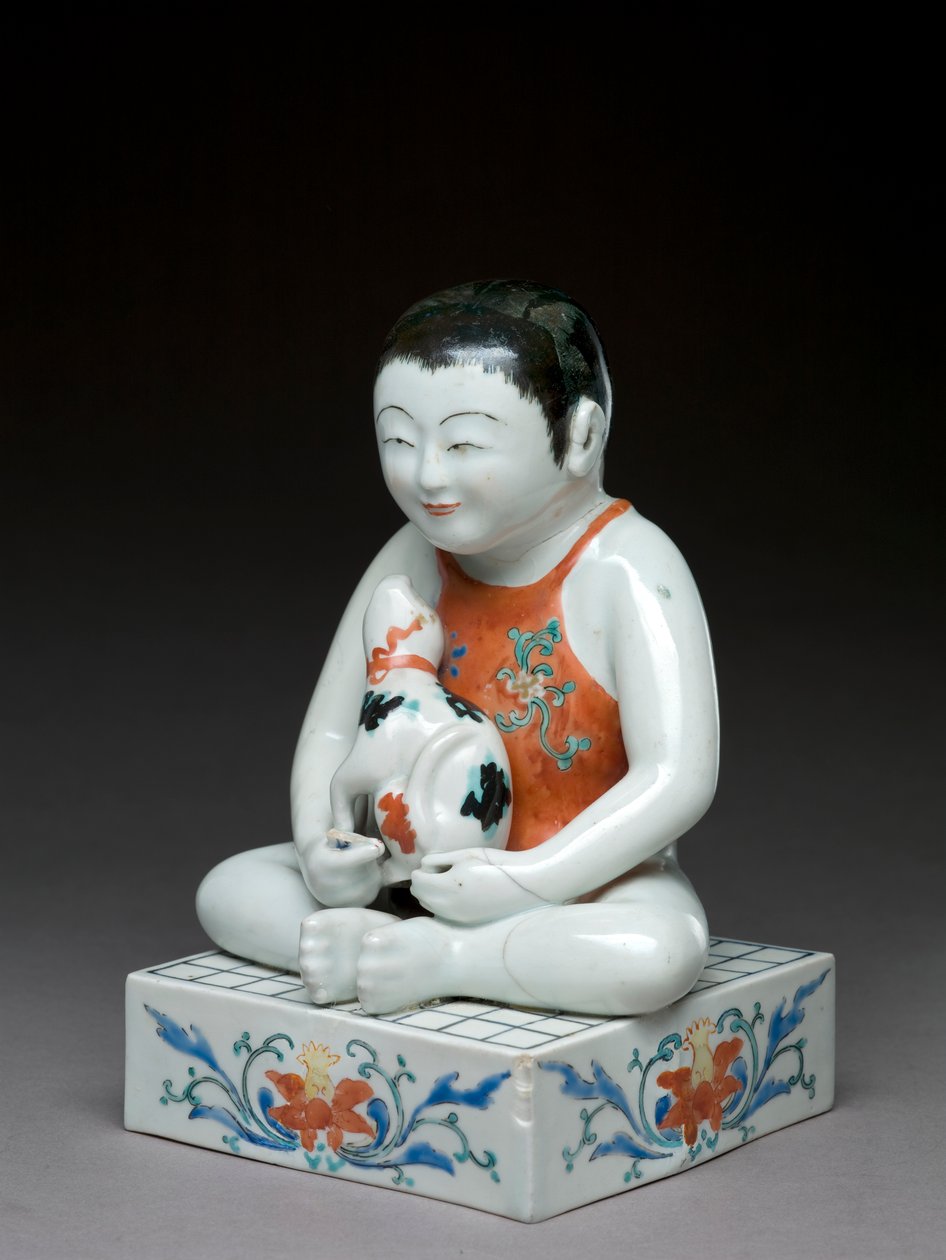 Chlapec se psem sedící na čtvercovém stole na šógi, příbuzné zboží Kakiemon, Japonsko, 1680-1700 (keramika s modrou podglazurou) od Japanese School