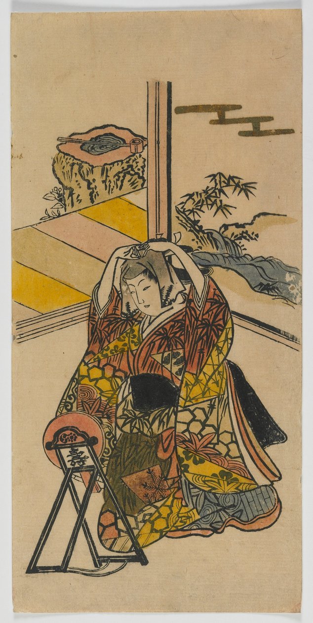 Mladá žena klečící vedle zrcadla, období Edo, 20. léta 18. století (barevný dřevotisk) od Japanese School