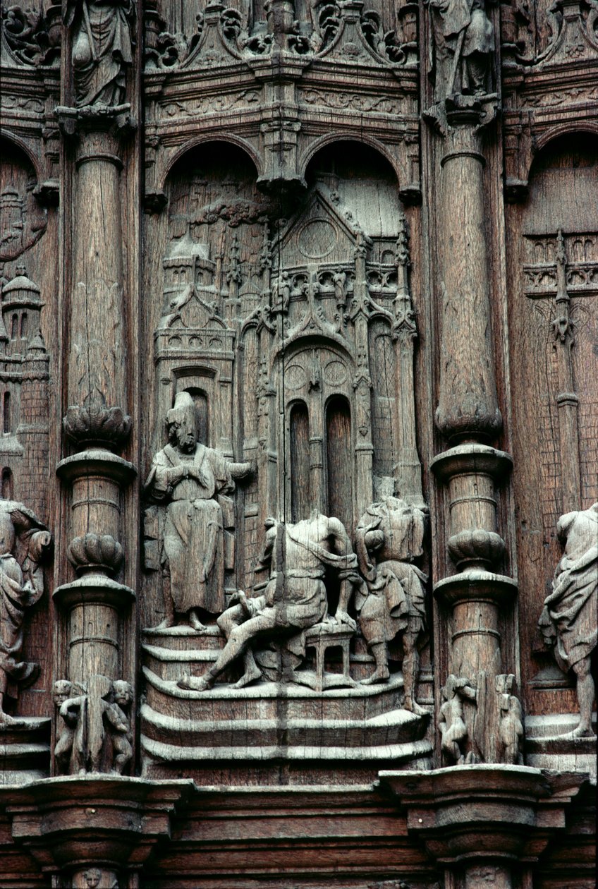 Svatý Petr léčí chromého muže, detail z jižního portálu transeptu, 16. století (dřevo) od Jean le Pot