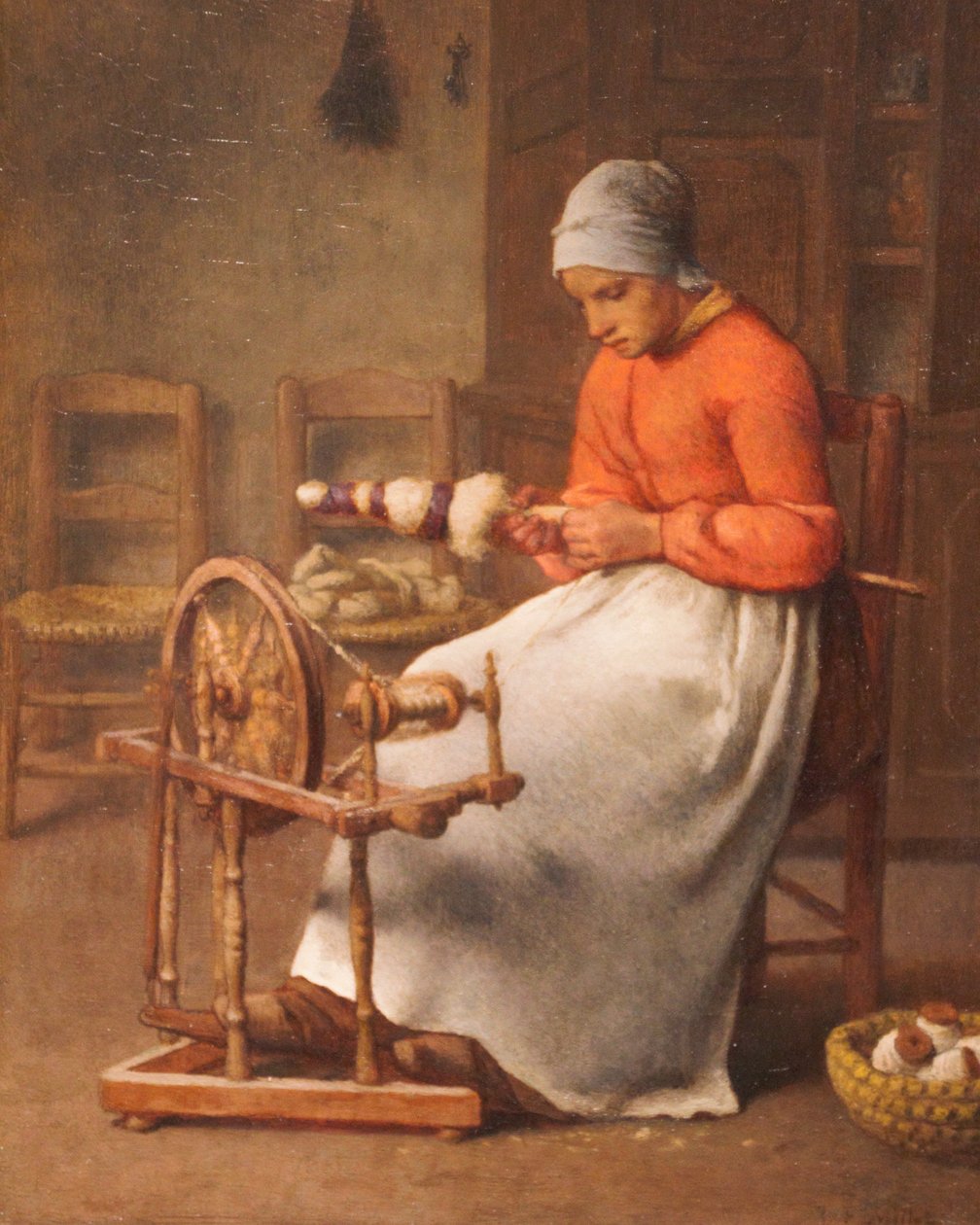 Žena přede od Jean-Francois Millet