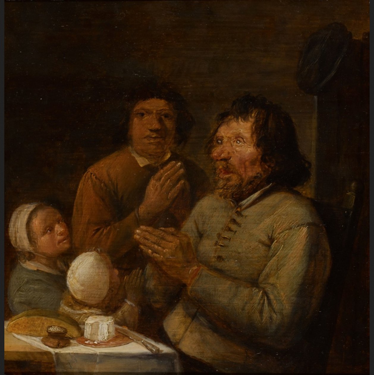 Interiér s modlící se rolnickou rodinou od Joos van Craesbeeck