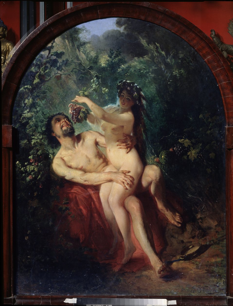 Satyr a nymfa. (Satyr a nymfa). Nahý a opilý pár, nymfa na kolenou satyra ho krmí hroznem sklizeným z vinic, které je obklopují. Obraz Konstantina Jegoroviče Makovského (Constantin Makovsky) (1839-1915), olej od Konstantin Egorovich Makovsky