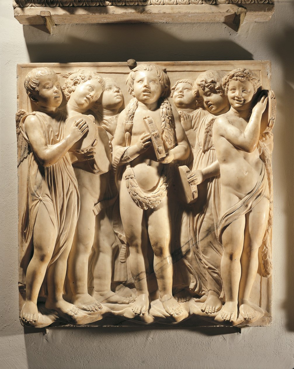 Laudate Eum in cymbalis bene sonantibus (Salmo 150, Laudate Dominum), panel s putti a anděly hrajícími na činely od Luca Della Robbia