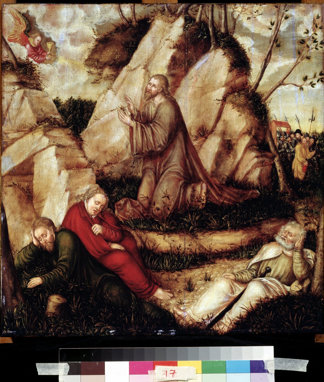 ""Modlitba v zahradě Olivetské"" (Agónie v zahradě) Po poslední večeři jde Kristus na kopec Getsemane, který s apoštoly dominuje Jeruzalému. Římští vojáci pobočníci Jidáše přistoupí, aby ho zatkli. Malba na dřevo od L od Lucas the Elder Cranach