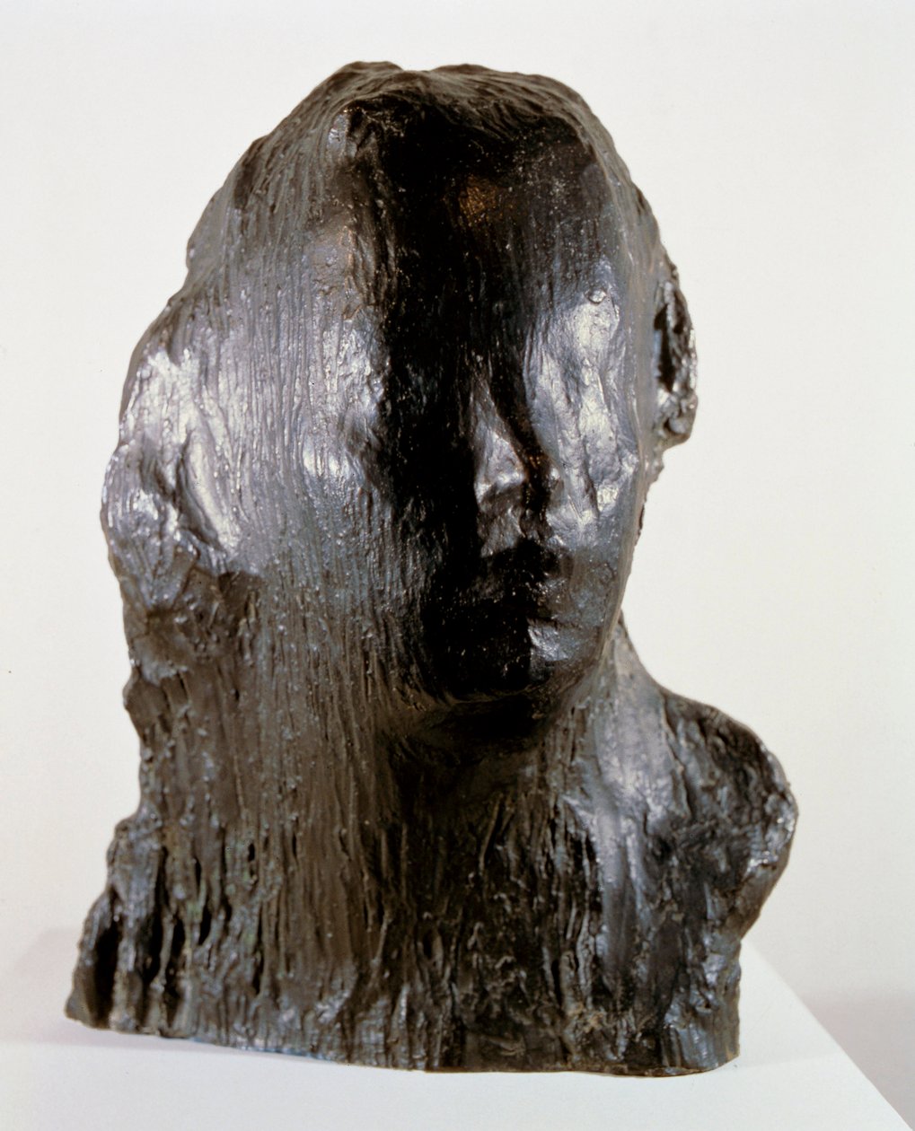 "Ecco Puer" (dětský tisk. Portrét Alfreda Monda ve věku šesti let) od Medardo Rosso