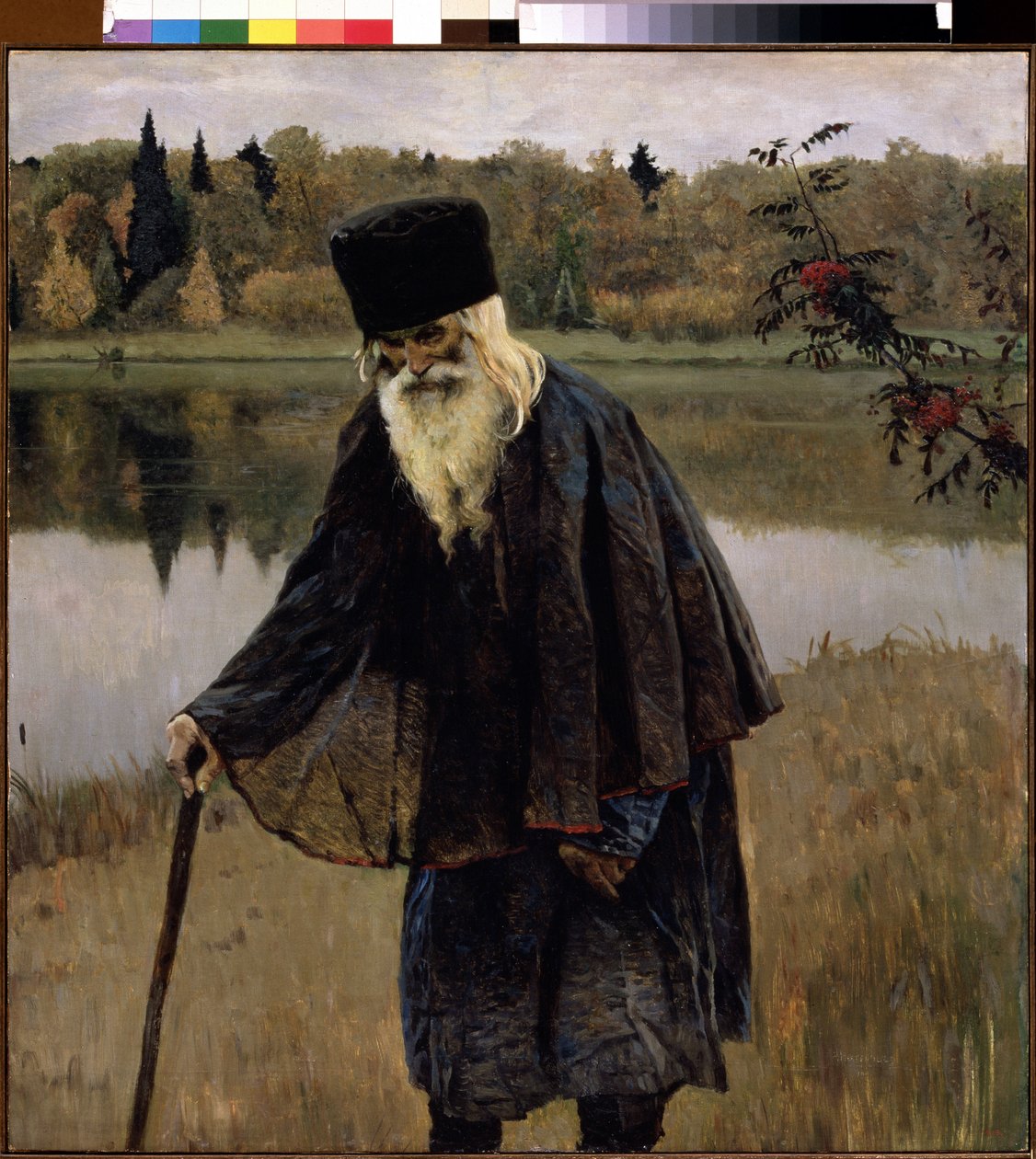 Poustevník (Poustevník). Starý muž s plnovousem a bílými vlasy kráčí ohnutý o hůl po břehu jezera. Obraz Michaila Vasiljeviče Nesterova (1862-1942), olej na plátně od Mikhail Vasilievich Nesterov