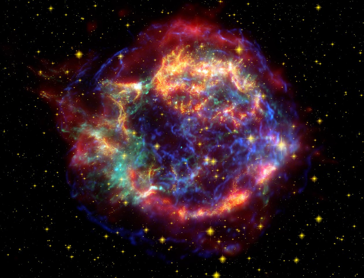 Snímek zbytku supernovy Cassiopeia A ve falešných barvách v souhvězdí Cassiopeia, vzdáleném 10 000 světelných let. Je to pozůstatek kdysi masivní hvězdy, která zahynula při výbuchu supernovy. Poděkujte NASA. Sci od National Aeronautics and Space Administration National Aeronautics and Space Administration