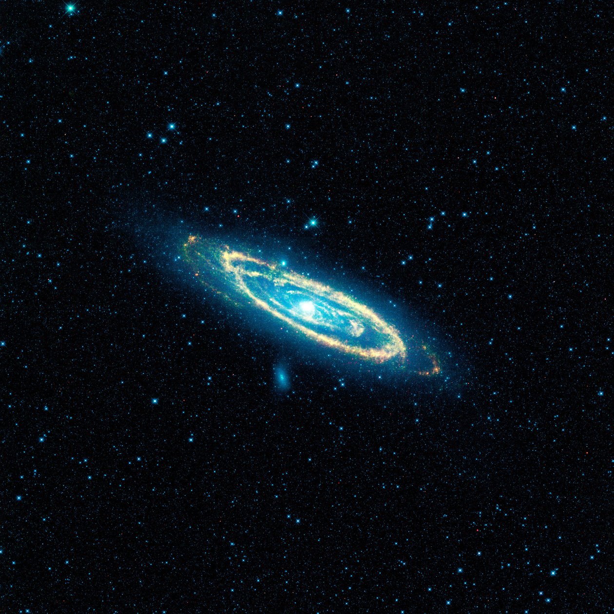 Snímek galaxie v Andromedě, M31, pořízený NASA Wide-field Infrared Survey Explorer (WISE). Mozaika pokrývá plochu odpovídající více než 100 úplňkům. Poděkujte NASA. Věda Astronomie od National Aeronautics and Space Administration National Aeronautics and Space Administration