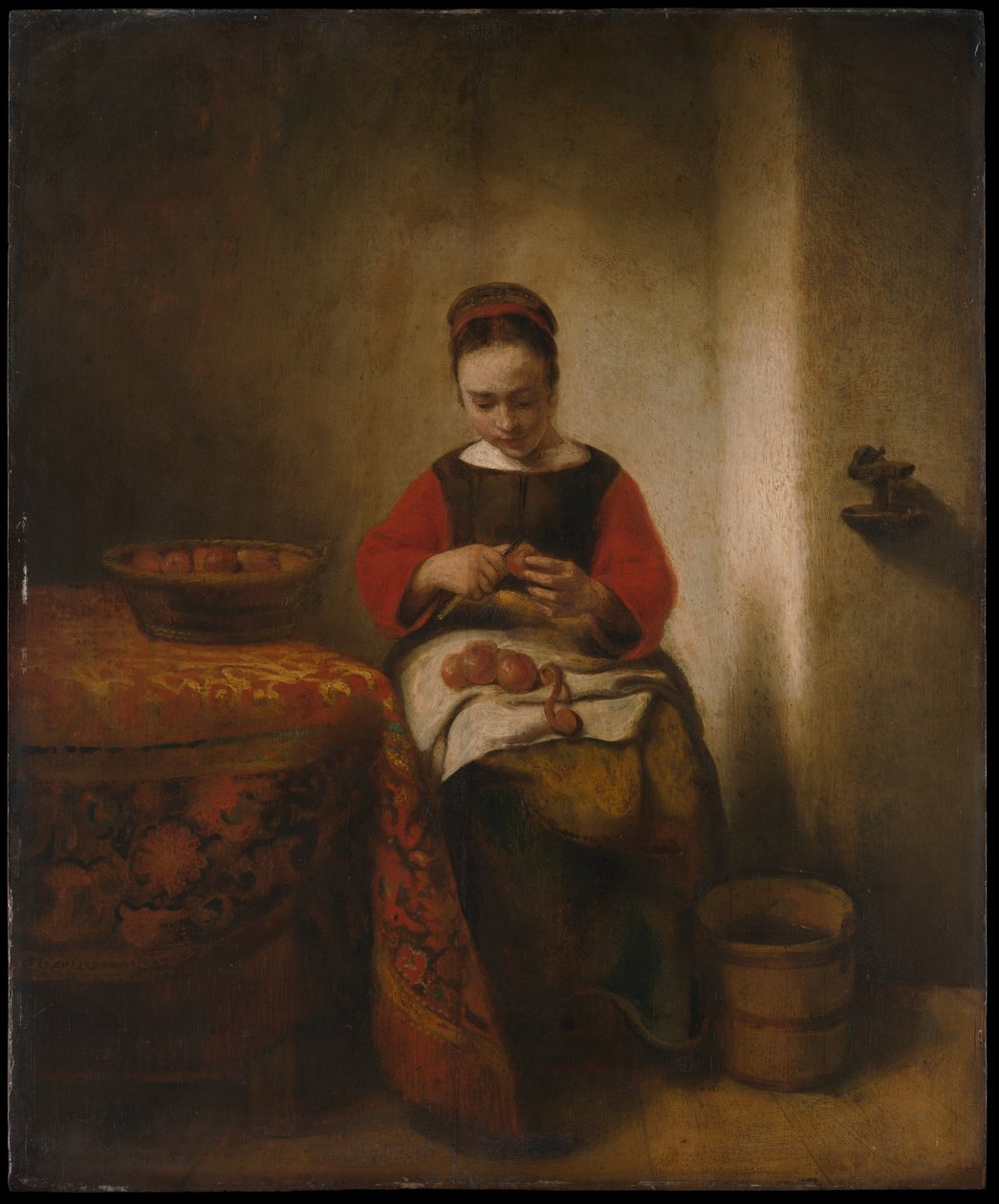 Mladá žena loupe jablka od Nicolaes Maes