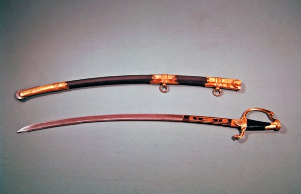 Pamětní meč, který dal Napoleon Bonaparte za to, že mu pomohl s úspěšným převratem v Saint Cloud dne 18. brumaire an 8 (9. listopadu 1799) (metal) od Nicolas Noel Boutet