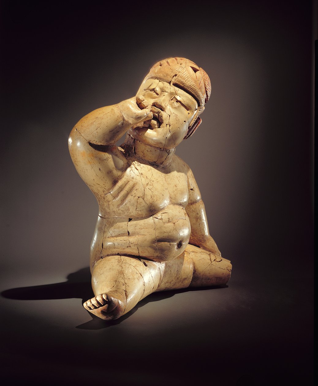 Figurka miminka (keramická, rumělka a červený okrová) od Olmec