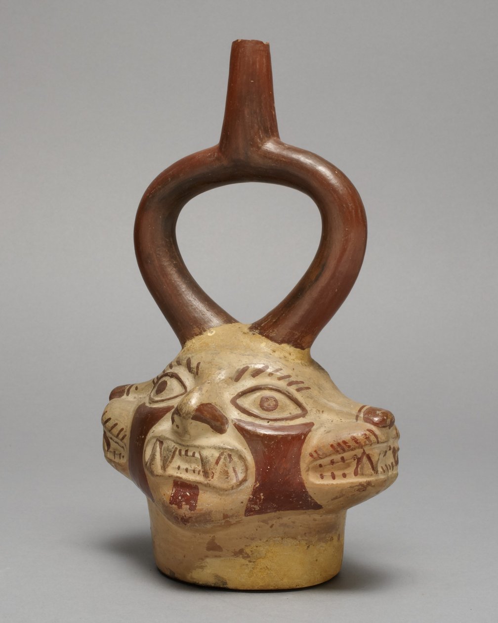 Třmenová nádoba ve formě vícehlavé kočky, 250-500 n. l. (keramika a pigment) od Peruvian School