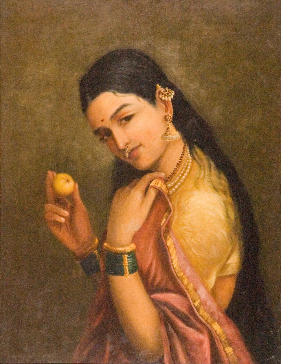 Žena držící ovoce od Raja Ravi Varma