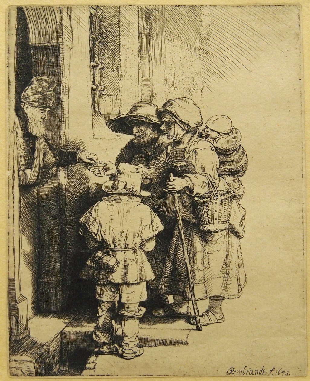 Slepý netečný hráč a rodina přijímající almužnu od Rembrandt van Rijn
