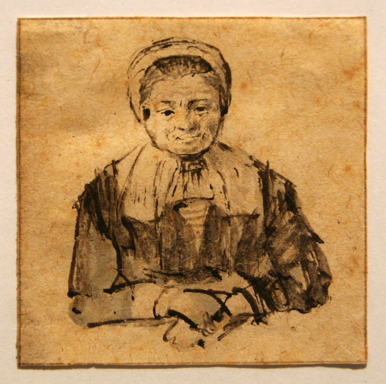 Stará žena se založenýma rukama od Rembrandt van Rijn