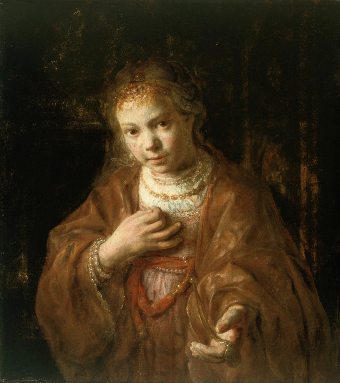 Mladá dívka držící medaili od Rembrandt