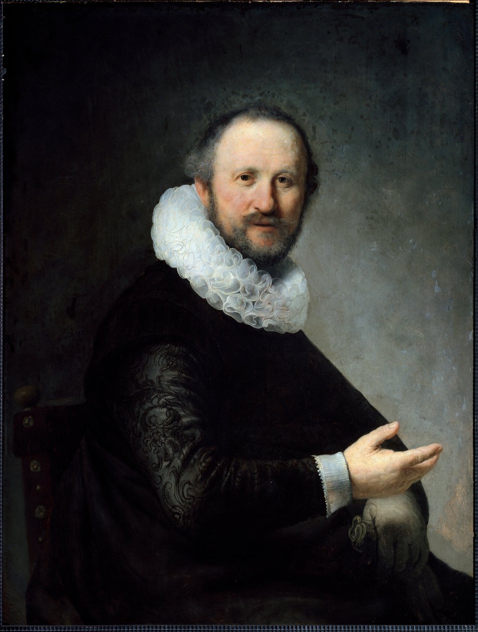 Holandský buržoazie drží rukavice a má na sobě límec. (Malování od Rembrandt van Rijn